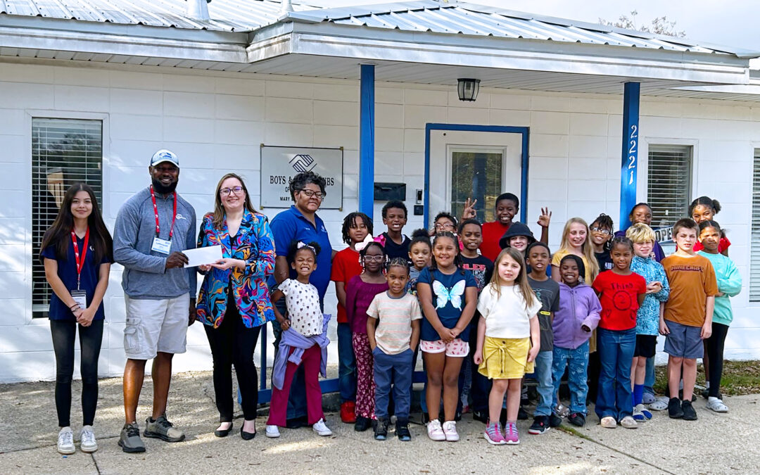 i9 Sports Presents Check to Boys & Girls Clubs of Jackson County from Basketball Fundraiser