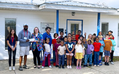i9 Sports Presents Check to Boys & Girls Clubs of Jackson County from Basketball Fundraiser